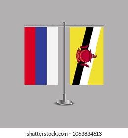 Table stand with flags of Russia and Brunei.Two flag. Flag pole. Symbolizing the cooperation between the two countries.Table flags