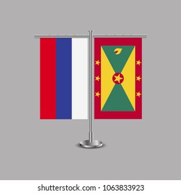 Table stand with flags of Russia and Grenada.Two flag. Flag pole. Symbolizing the cooperation between the two countries.Table flags