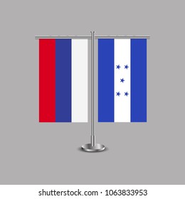 Table stand with flags of Russia and Honduras.Two flag. Flag pole. Symbolizing the cooperation between the two countries.Table flags