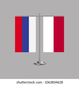 Table stand with flags of Russia and Indonesia.Two flag. Flag pole. Symbolizing the cooperation between the two countries.Table flags