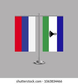Table stand with flags of Russia and Lesotho.Two flag. Flag pole. Symbolizing the cooperation between the two countries.Table flags