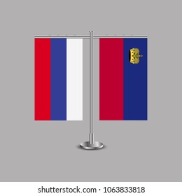 Table stand with flags of Russia and Liechtenstein.Two flag. Flag pole. Symbolizing the cooperation between the two countries.Table flags