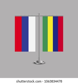 Table stand with flags of Russia and Mauritius.Two flag. Flag pole. Symbolizing the cooperation between the two countries.Table flags