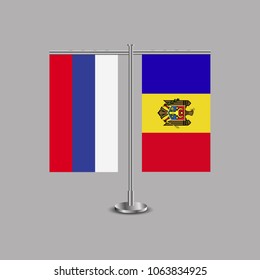 Table stand with flags of Russia and Moldova.Two flag. Flag pole. Symbolizing the cooperation between the two countries.Table flags