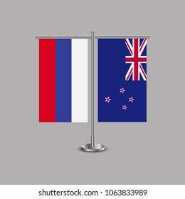 Table stand with flags of Russia and New Zealand.Two flag. Flag pole. Symbolizing the cooperation between the two countries.Table flags