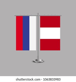 Table stand with flags of Russia and Peru.Two flag. Flag pole. Symbolizing the cooperation between the two countries.Table flags