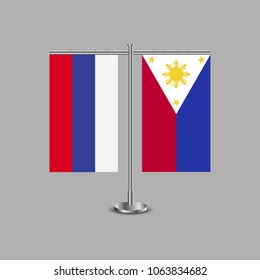 Table stand with flags of Russia and Philippines.Two flag. Flag pole. Symbolizing the cooperation between the two countries.Table flags