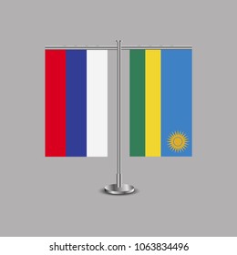 Table stand with flags of Russia and Rwanda.Two flag. Flag pole. Symbolizing the cooperation between the two countries.Table flags