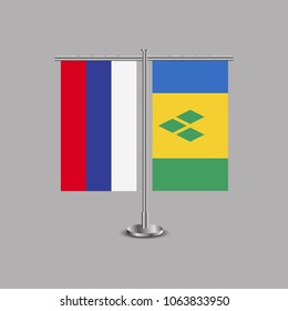 Table stand with flags of Russia and Saint Vincent and the Grenadines.Two flag. Flag pole. Symbolizing the cooperation between the two countries.Table flags