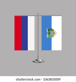 Table stand with flags of Russia and San marino.Two flag. Flag pole. Symbolizing the cooperation between the two countries.Table flags