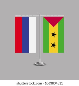 Table stand with flags of Russia and Sao Tome and Principe.Two flag. Flag pole. Symbolizing the cooperation between the two countries.Table flags