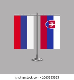 Table stand with flags of Russia and Slovakia.Two flag. Flag pole. Symbolizing the cooperation between the two countries.Table flags