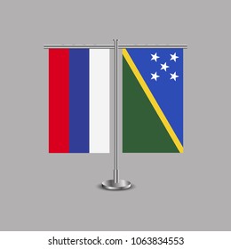 Table stand with flags of Russia and Solomon islands.Two flag. Flag pole. Symbolizing the cooperation between the two countries.Table flags