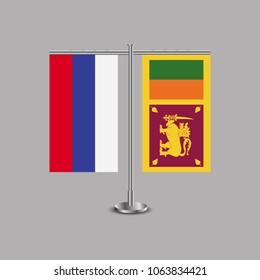 Table stand with flags of Russia and Sri Lanka.Two flag. Flag pole. Symbolizing the cooperation between the two countries.Table flags