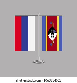 Table stand with flags of Russia and Swaziland.Two flag. Flag pole. Symbolizing the cooperation between the two countries.Table flags