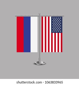 Table stand with flags of Russia and USA.Two flag. Flag pole. Symbolizing the cooperation between the two countries.Table flags