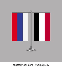 Table stand with flags of Russia and Yemen.Two flag. Flag pole. Symbolizing the cooperation between the two countries.Table flags