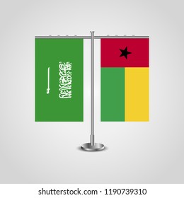 Table stand with flags of Saudi Arabia and Guinea-Bissau.Two flag. Flag pole. Symbolizing the cooperation between the two countries. Table flags