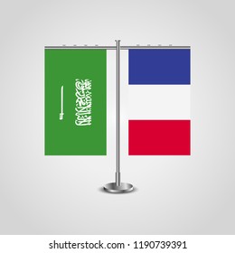 Table stand with flags of Saudi Arabia and France.Two flag. Flag pole. Symbolizing the cooperation between the two countries. Table flags