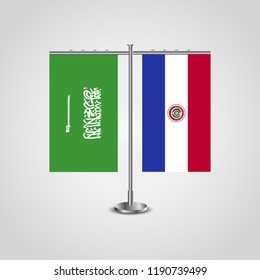 Table stand with flags of Saudi Arabia and Paraguay.Two flag. Flag pole. Symbolizing the cooperation between the two countries. Table flags