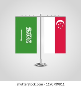 Table stand with flags of Saudi Arabia and Singapore.Two flag. Flag pole. Symbolizing the cooperation between the two countries. Table flags