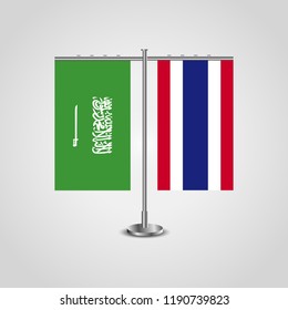 Table stand with flags of Saudi Arabia and Thailand.Two flag. Flag pole. Symbolizing the cooperation between the two countries. Table flags