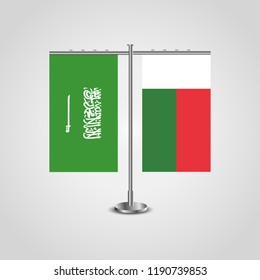 Table stand with flags of Saudi Arabia and Madagascar.Two flag. Flag pole. Symbolizing the cooperation between the two countries. Table flags