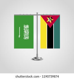 Table stand with flags of Saudi Arabia and Mozambique.Two flag. Flag pole. Symbolizing the cooperation between the two countries. Table flags