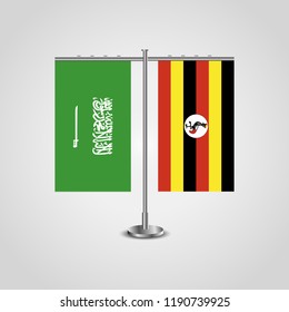 Table stand with flags of Saudi Arabia and Uganda.Two flag. Flag pole. Symbolizing the cooperation between the two countries. Table flags