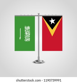 Table stand with flags of Saudi Arabia and East Timor.Two flag. Flag pole. Symbolizing the cooperation between the two countries. Table flags