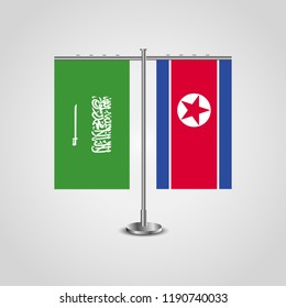 Table stand with flags of Saudi Arabia and North Korea.Two flag. Flag pole. Symbolizing the cooperation between the two countries. Table flags