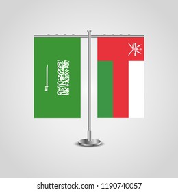 Table stand with flags of Saudi Arabia and Oman.Two flag. Flag pole. Symbolizing the cooperation between the two countries. Table flags