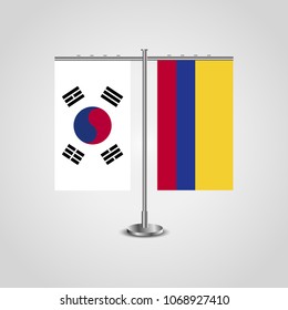 Table stand with flags of South Korea and Colombia.Two flag. Flag pole. Symbolizing the cooperation between the two countries. Table flags