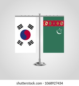 Table stand with flags of South Korea and Turkmenistan.Two flag. Flag pole. Symbolizing the cooperation between the two countries. Table flags