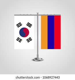 Table stand with flags of South Korea and Armenia.Two flag. Flag pole. Symbolizing the cooperation between the two countries. Table flags