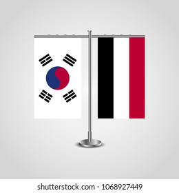 Table stand with flags of South Korea and Yemen.Two flag. Flag pole. Symbolizing the cooperation between the two countries. Table flags