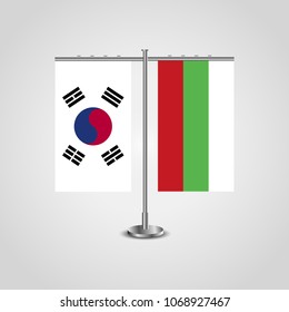 Table stand with flags of South Korea and Bulgaria.Two flag. Flag pole. Symbolizing the cooperation between the two countries. Table flags