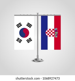 Table stand with flags of South Korea and Croatia.Two flag. Flag pole. Symbolizing the cooperation between the two countries. Table flags