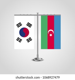 Table stand with flags of South Korea and Azerbaijan.Two flag. Flag pole. Symbolizing the cooperation between the two countries. Table flags