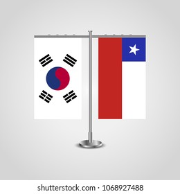 Table stand with flags of South Korea and Chile.Two flag. Flag pole. Symbolizing the cooperation between the two countries. Table flags