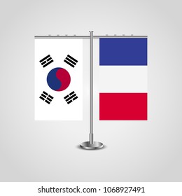 Table stand with flags of South Korea and France.Two flag. Flag pole. Symbolizing the cooperation between the two countries. Table flags