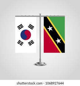 Table stand with flags of South Korea and Saint Kitts and Nevis.Two flag. Flag pole. Symbolizing the cooperation between the two countries. Table flags
