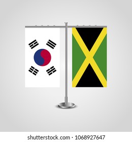 Table stand with flags of South Korea and Jamaica.Two flag. Flag pole. Symbolizing the cooperation between the two countries. Table flags