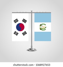 Table stand with flags of South Korea and Guatemala.Two flag. Flag pole. Symbolizing the cooperation between the two countries. Table flags