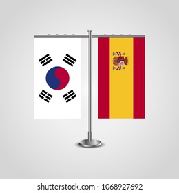 Table stand with flags of South Korea and Spain.Two flag. Flag pole. Symbolizing the cooperation between the two countries. Table flags