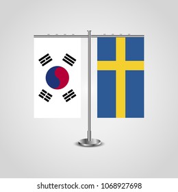 Table stand with flags of South Korea and Sweden.Two flag. Flag pole. Symbolizing the cooperation between the two countries. Table flags
