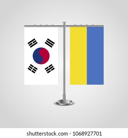 Table stand with flags of South Korea and Ukraine.Two flag. Flag pole. Symbolizing the cooperation between the two countries. Table flags