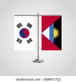 Table stand with flags of South Korea and Antigua and Barbuda.Two flag. Flag pole. Symbolizing the cooperation between the two countries. Table flags