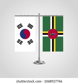 Table stand with flags of South Korea and Dominica.Two flag. Flag pole. Symbolizing the cooperation between the two countries. Table flags