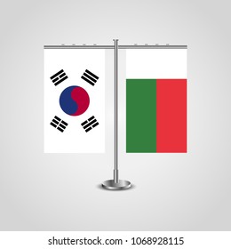 Table stand with flags of South Korea and Madagascar.Two flag. Flag pole. Symbolizing the cooperation between the two countries. Table flags